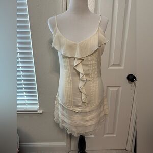 Elegant dress with ruffle details, perfect for a sophisticated occasion.